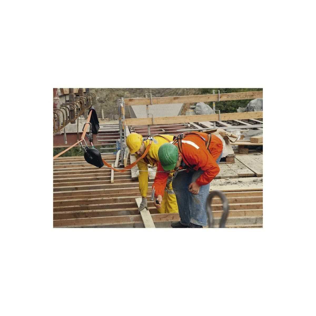 Workers using height safety harnesses