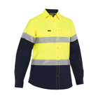 Back view of high visibility yellow women's work shirt with reflective tape