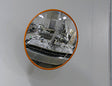 Food processing stainless steel mirror mounted on a wall