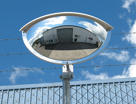 Outdoor half dome acrylic mirror mounted for two-way driveway visibility